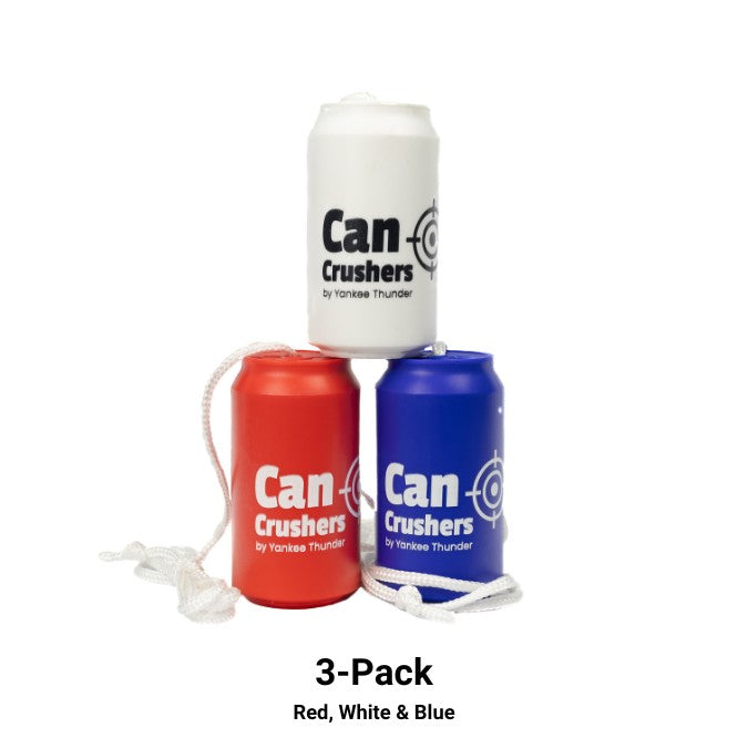 Three Can Crushers Targets by Yankee Thunder are featured, arranged in a pyramid. The cans are colored white, red, and blue, each with a white string attached. Made from durable and reusable materials, these shatterproof targets are ideal for any occasion. Text below them reads, 