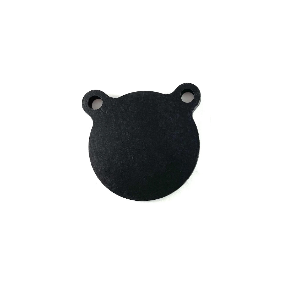 The AR500 4-inch Gongs 3/8" Thick by Yankee Thunder is a flat, circular black object with two small circular extensions at the top, each featuring a hole in the center, resembling a bear’s head. Made of solid AR500 steel, this product is commonly used as training targets to improve shooting skills.